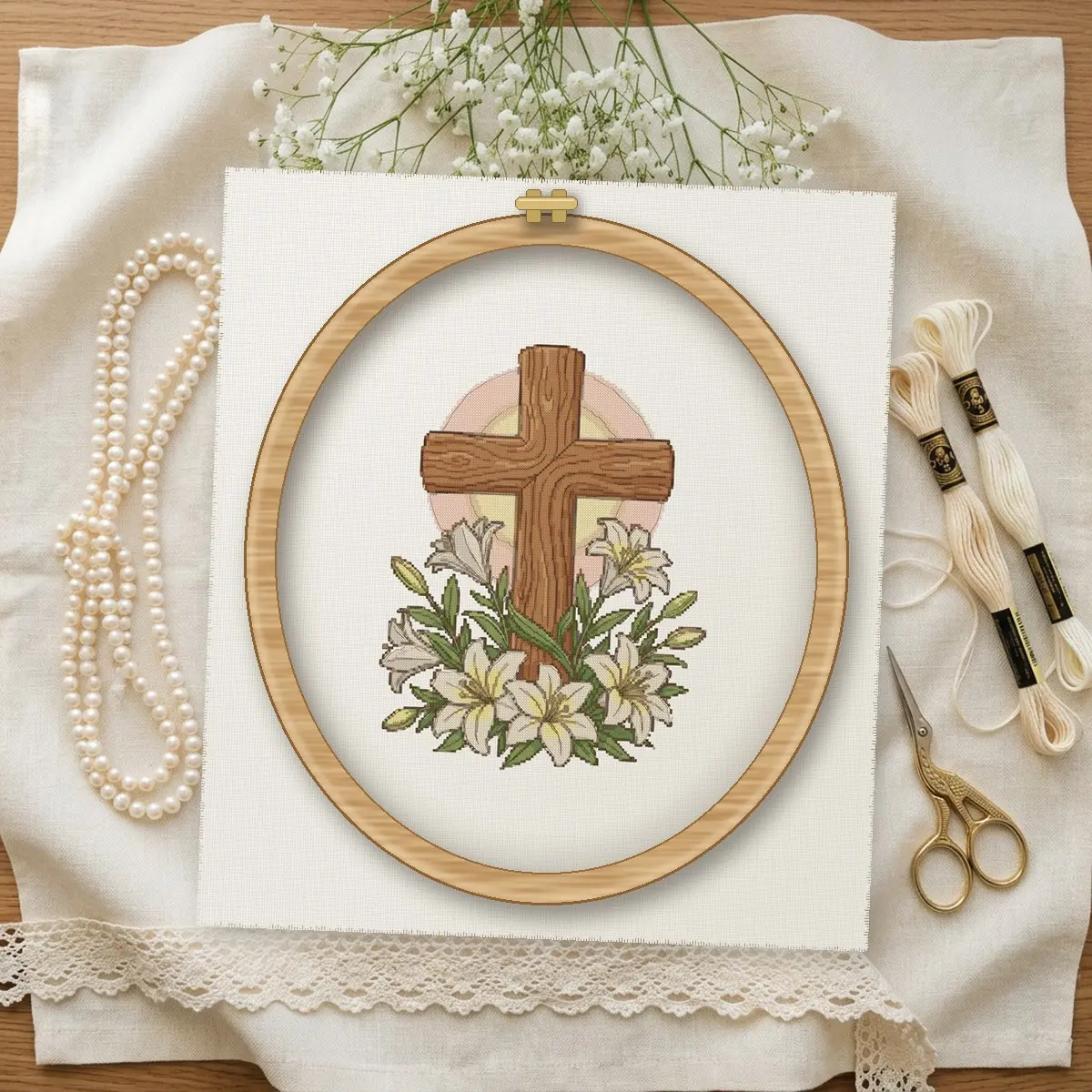 Easter Cross with Lilies cross stitch pattern stitched in a wooden hoop