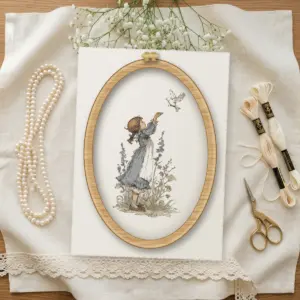 Girl Releasing a Dove cross stitch pattern stitched in a wooden hoop